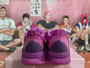 Rear view showing the purple heels, textured heel panels, and sculpted soles.