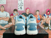 Rear view of the pair showing padded collars, gray heel panels and blue details.