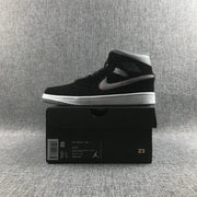 Air Jordan 1 Mid sneaker displayed on its box; the box shows EUR 41, UK 7, style code 554724 060 and black, grey and white color text.