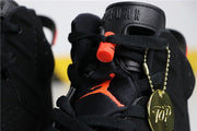 Close-up of the padded tongue with Jordan branding, infrared lace hardware and a decorative round hangtag.