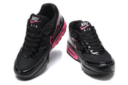 Front view of black and pink Nike Air Max BW sneakers