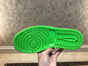 View of the bright green textured rubber outsole with circular pivot area and patterned tread.