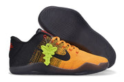 Orange and black basketball sneaker shown beside its dark textured outsole and bright green accessory.
