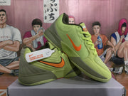 Pair of lime-green Nike Zoom Freak basketball shoes shown from side and top angles