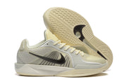 Nike Kobe 5 Protro shoe pair showing side profiles and patterned outsoles