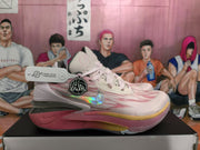 Side view of a pink and light-colored Nike basketball sneaker showing the Swoosh, layered upper details, and sculpted sole.