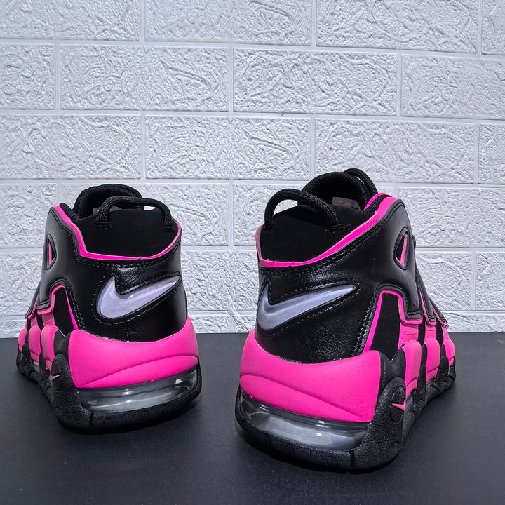 Rear view of black and pink Nike Air More Uptempo sneakers