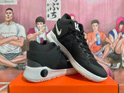 Angled view of the black and white Nike KD Trey 5 shoes, showing the side and heel.