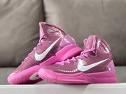 Pair of mauve and pink high-tops shown at an angle, with patterned soles visible.