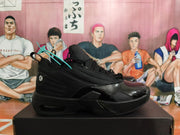 Side view of a black Jordan low-top basketball shoe with a visible heel cushioning window.