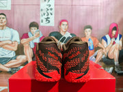 Rear view of the sneakers showing the padded heels, red patterned detailing, and visible “TWC LUV” text.