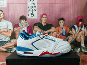 Side view showing the perforated panel, blue trim, cushioning window, and red midsole detail