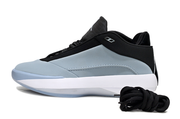 Side profile of a blue gray Jordan 40 shoe with black upper trim and white midsole.
