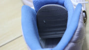Close-up of the dark textured insole area inside the sneaker.