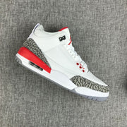Angled side view showing the grey elephant-print overlays and red accents