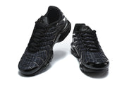 Pair of black grid-pattern sneakers viewed from above
