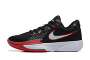 Side profile of a black basketball shoe with a white and red-trimmed Swoosh, patterned side panel, white midsole, and red outsole.