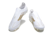 Top view of white adidas F50 laceless soccer cleats with gold-colored branding and detailing.