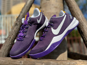 Pair of purple Kobe 8 shoes shown at an angle.