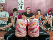 Rear view of pink Nike sneakers with textured pink detailing and pale pink patterned soles.
