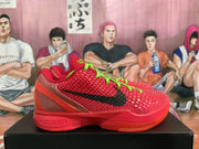 Side profile of a red Nike Zoom basketball sneaker showing black side branding, translucent paneling and a sculpted sole.