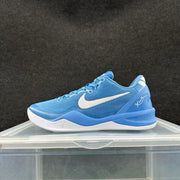 Side profile of a blue basketball shoe with white Swoosh