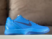 Side view of a blue Nike Kobe 6 basketball shoe with a textured upper and dark Swoosh.