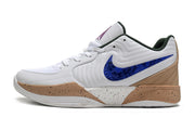 Side view of white Nike Ja 2 basketball shoe with blue accents and tan panels