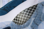 Close-up of the patterned navy upper and translucent outsole detail.