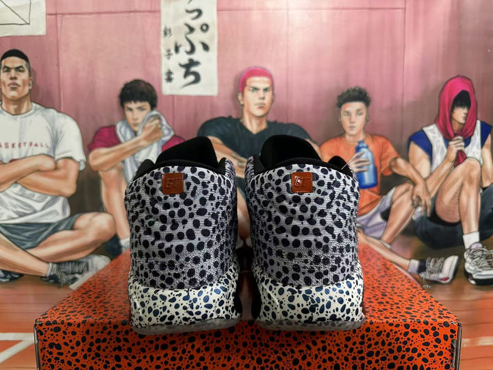 Rear view of black-and-white spotted Nike basketball shoes