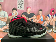 Side profile showing the glossy black molded upper, Nike swoosh, and pale outsole.