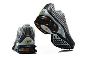 Rear and outsole views of grey and black Nike Air Max Plus VII sneakers.