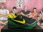 Side view of black basketball sneakers with yellow Swoosh branding, green heel and outsole panels, and yellow collar accents.