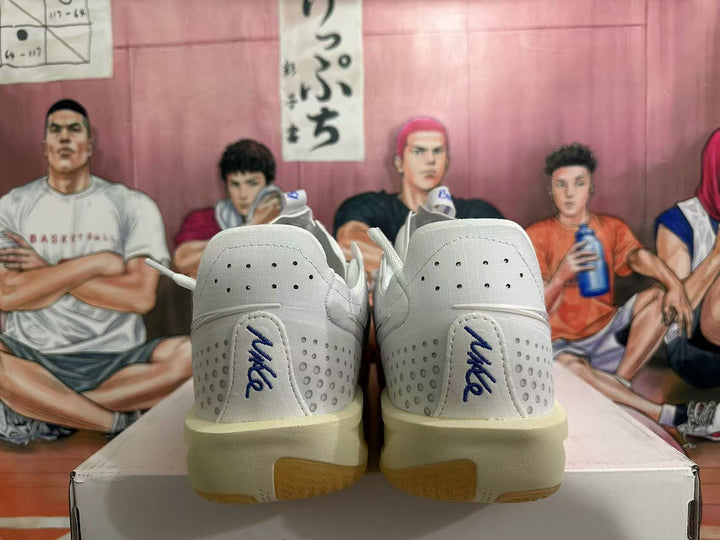 Rear view of white Nike sneakers showing blue heel branding, perforated panels, and gum-colored outsole sections.