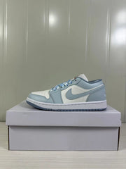 Single low-top sneaker shown in side profile on a white shoebox.