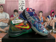 Angled view of the mismatched sneakers, showing the colorful patterned uppers, contrasting laces and visible Nike tags.
