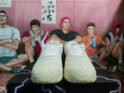 Front view showing the white laces, textured toe boxes, and patterned outsoles.