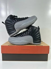Pair of black and grey Air Jordan 12 high-top sneakers shown from opposing side angles