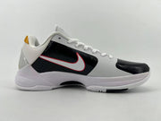 Side profile of the shoe with perforated black side panel and white-and-red Swoosh
