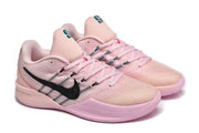 Angled pair view of pink Nike Sabrina 2 basketball shoes with black Swooshes