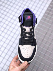 Top view showing the perforated light-colored toe box, black overlays, laces and tongue branding.