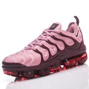 Angled view of a pink and plum Nike TN-18 lace-up sneaker.