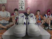 Front view showing white laces, mesh panels, and purple tongue branding