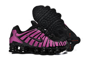 Nike Shox TL sneakers shown from the side with one shoe turned over to display the outsole.