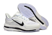 White Nike Pegasus Premium shoes shown from the side and outsole.