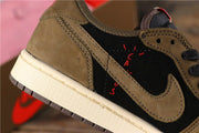 Close-up of the brown side overlay, black panel, stitching, and red graphic details.