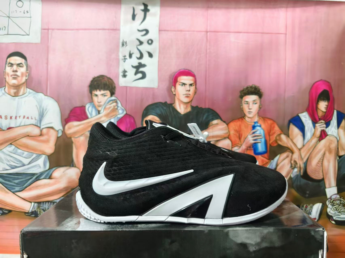 Black Nike basketball sneaker with white Swoosh and angular side detailing, shown in profile.