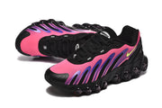 Angled side and top views showing the pink, purple, and black sneaker design
