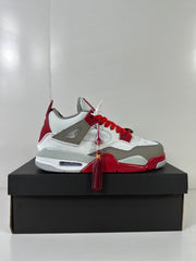 Opposite side profile showing the mid-top sneaker shape, red outsole accents, gray overlays, and hanging tassel.