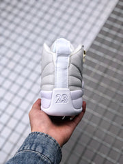 Rear view of the sneaker showing the vertical heel pull tab and raised 23 detail.